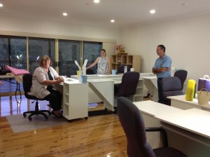 Part of the workroom (couldn't fit it all in) with a table and light for each person